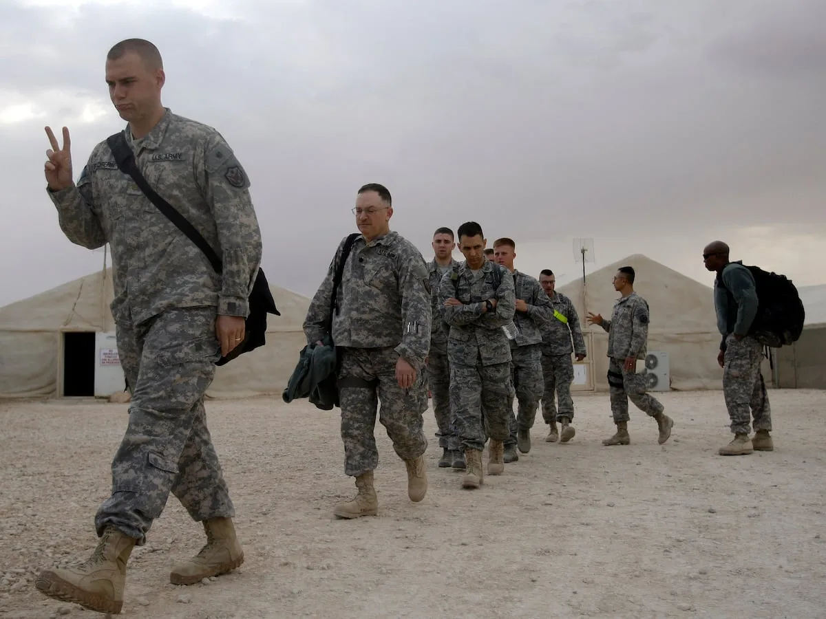 As last US troops pack up in Iraq, militias signal their weapons will stay
