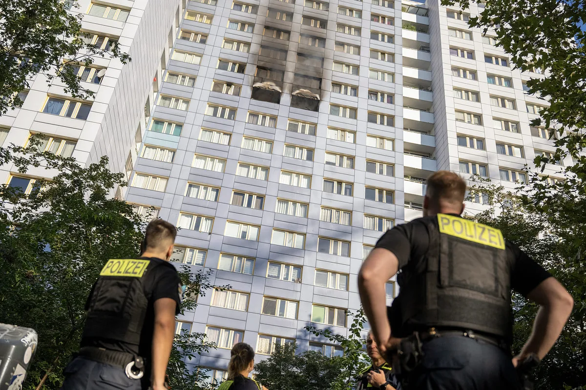 Woman leaps from 11th-floor ledge into firefighter’s arms as Berlin high-rise burns