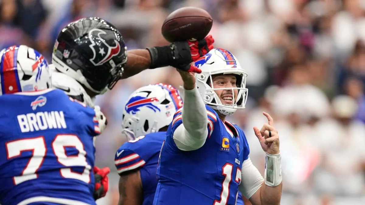 Bills’ Allen connects with Palmer on late touchdown strike
