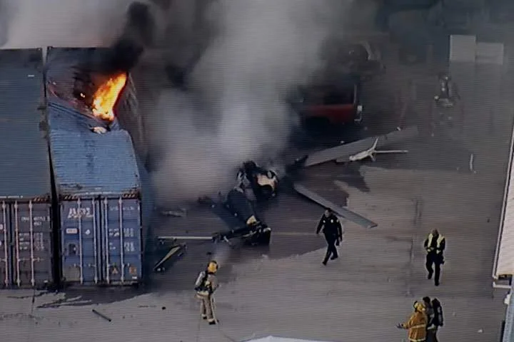Helicopter crashes and bursts into flames, killing at least 3 people near an LA bus collision