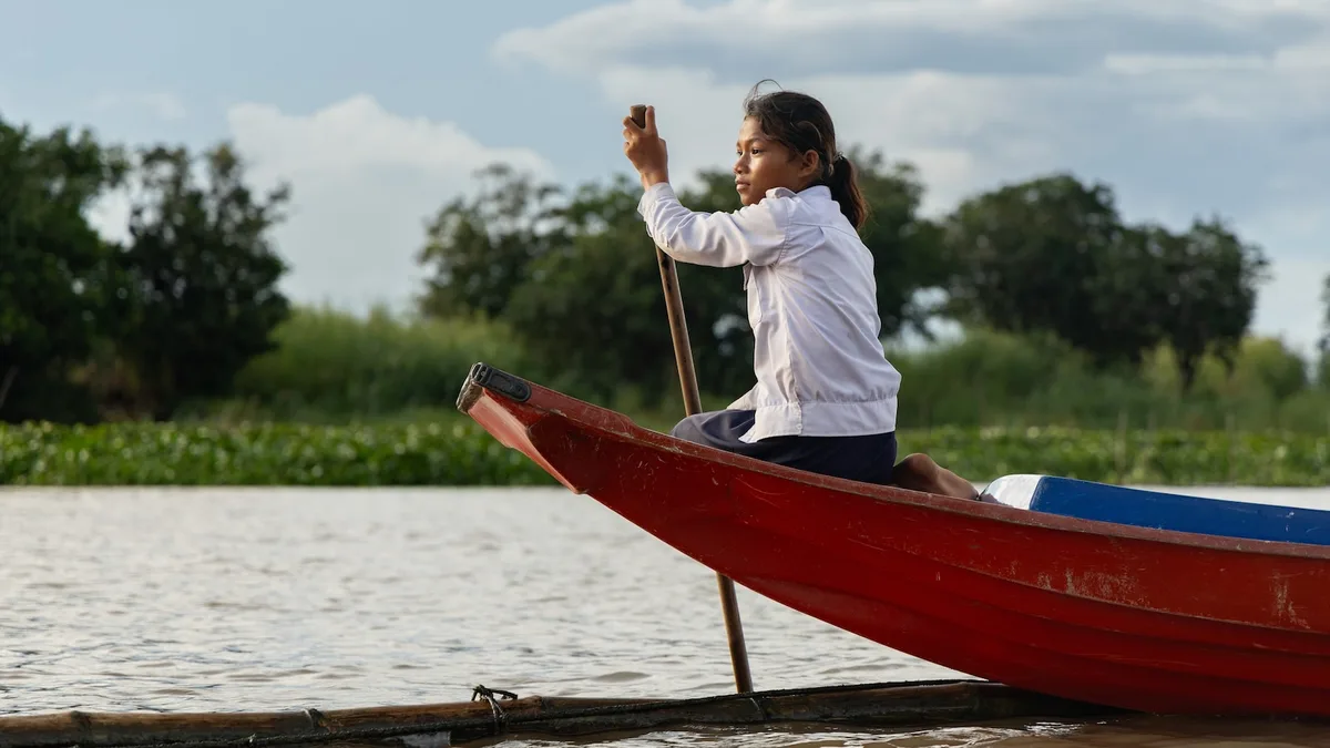 Photos show Cambodian children attend school in floating villages