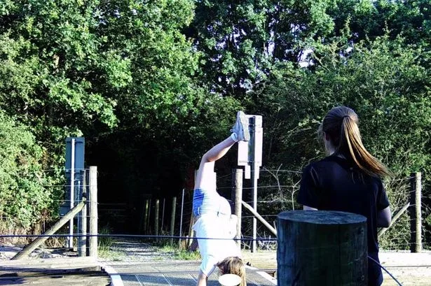 Brickfields level crossing closed as children seen doing handstands beside train tracks