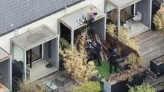 Watch moment police arrest wanted man while he slept on roof