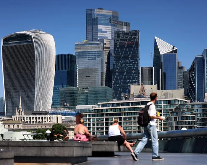 UK economy unexpectedly grows in August despite fall in consumer spending