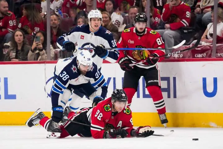 Winnipeg Jets rally from two goals down before losing in overtime 4-3 in Chicago