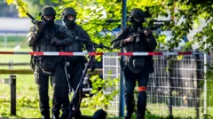 Manhunt after one killed and five injured in Swiss shooting, police say