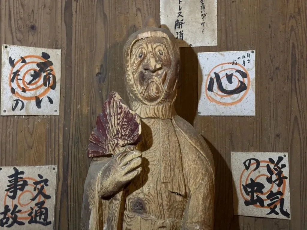 This shrine in Japan invites you to hit and kick its god of poverty statue for good luck [Photos]