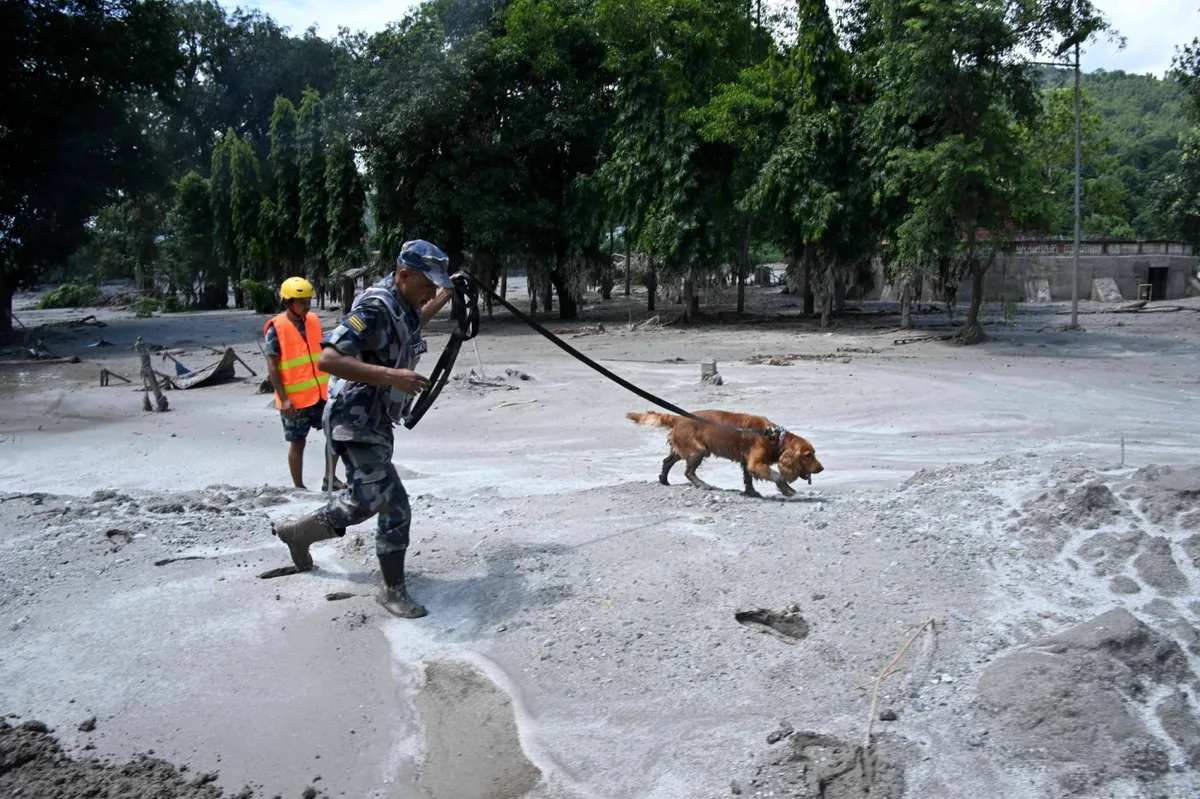 Nepal says dam burst in Tibet, warns rescuers to head to safety