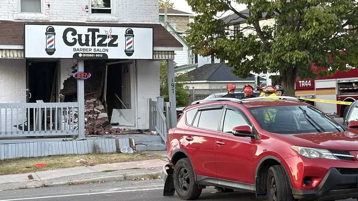 1 dead, 1 hospitalized after SUV backs into barber shop