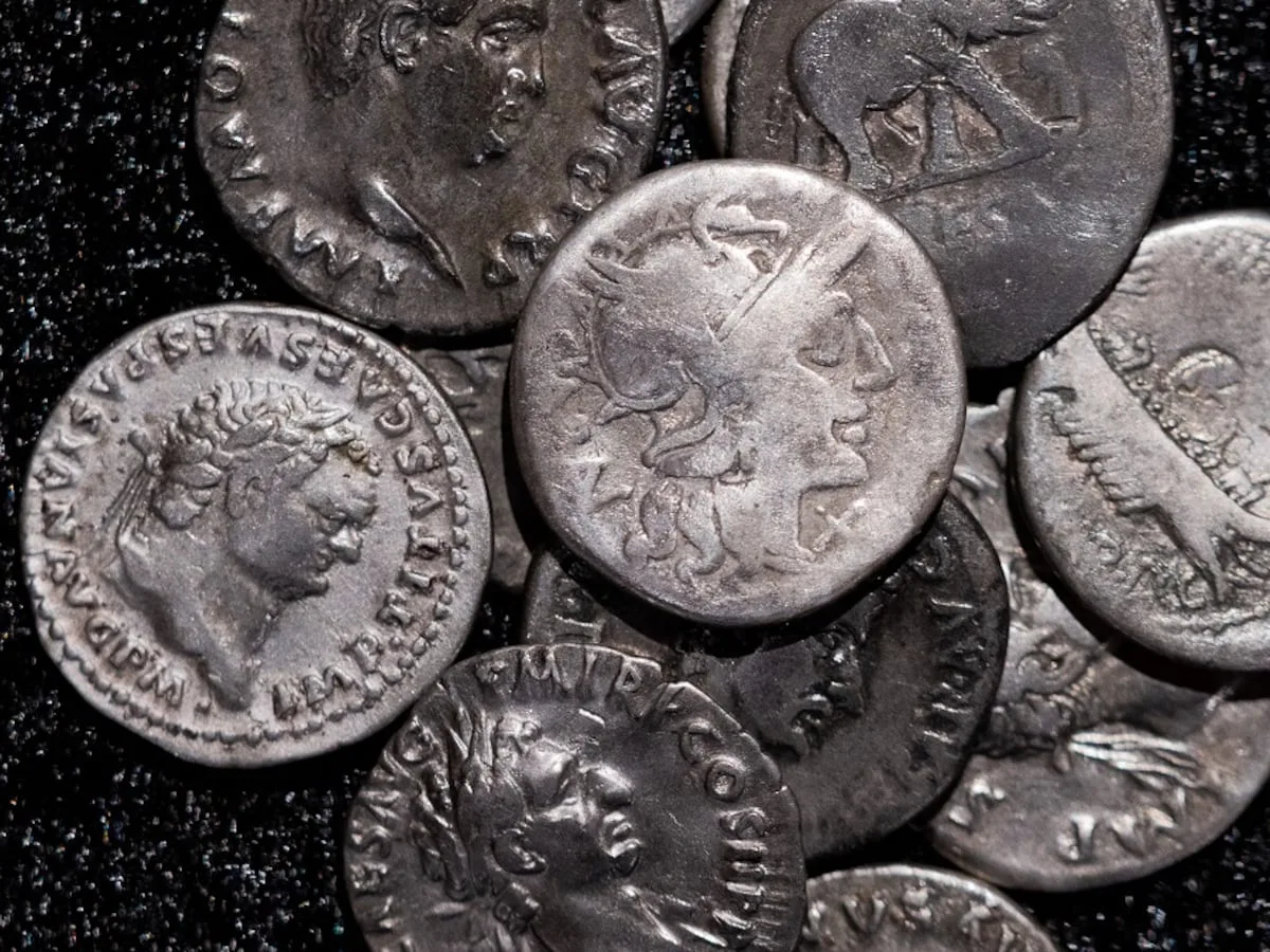 Amateur archaeologist finds Germany’s biggest cache of Roman silver coins