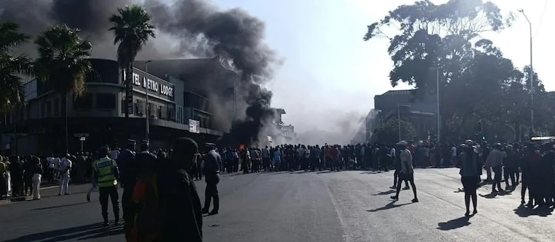WATCH | Protesters set vehicles alight in Durban CBD