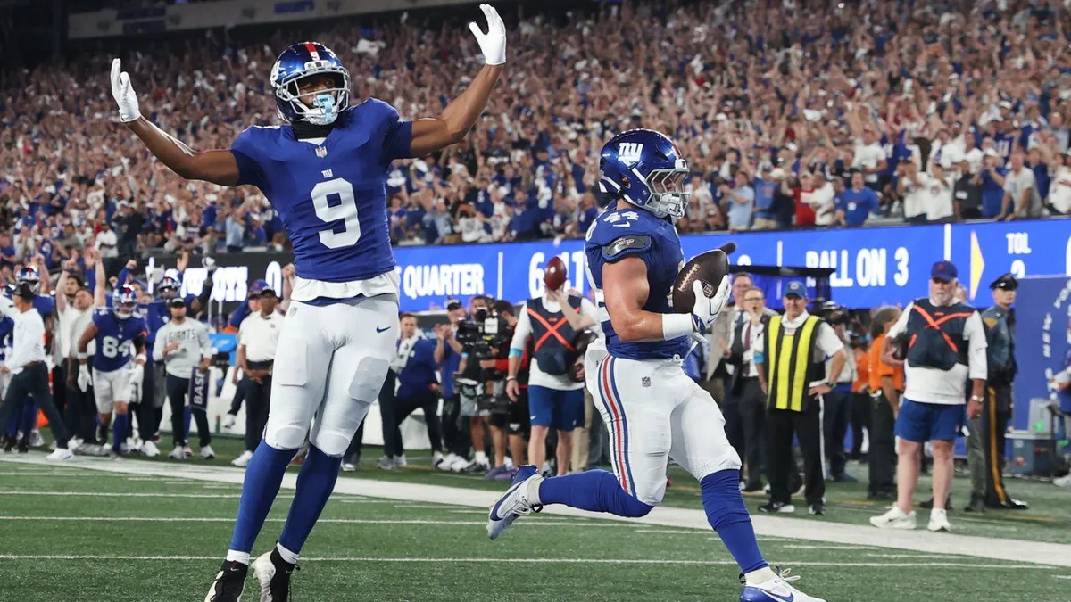 Giants’ offence rolls over Cowboys to give coach John Harbaugh a win in his debut