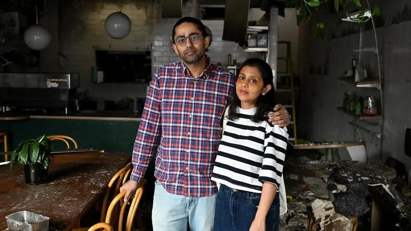 Victorian couple pleads for government intervention after tobacco shop firebombing destroys their beloved Melbourne cafe